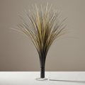 Black and gold metallic spray centrepiece on a white-clothed table