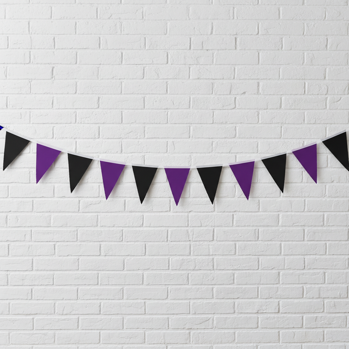 Black Purple Bunting Strung on White Brick Wall