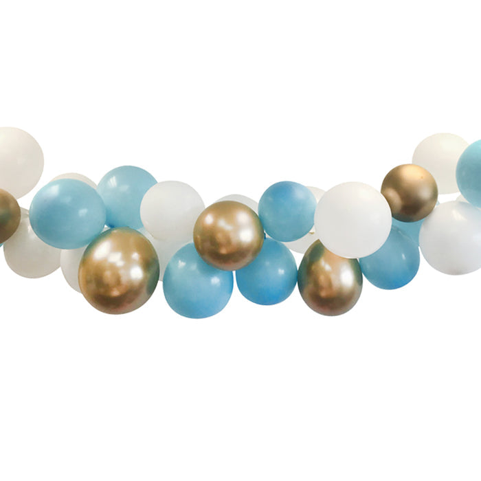 A completed balloon arch decoration featuring a series of round balloons in white, light blue, and chrome gold shades, arranged in a arch shape.
