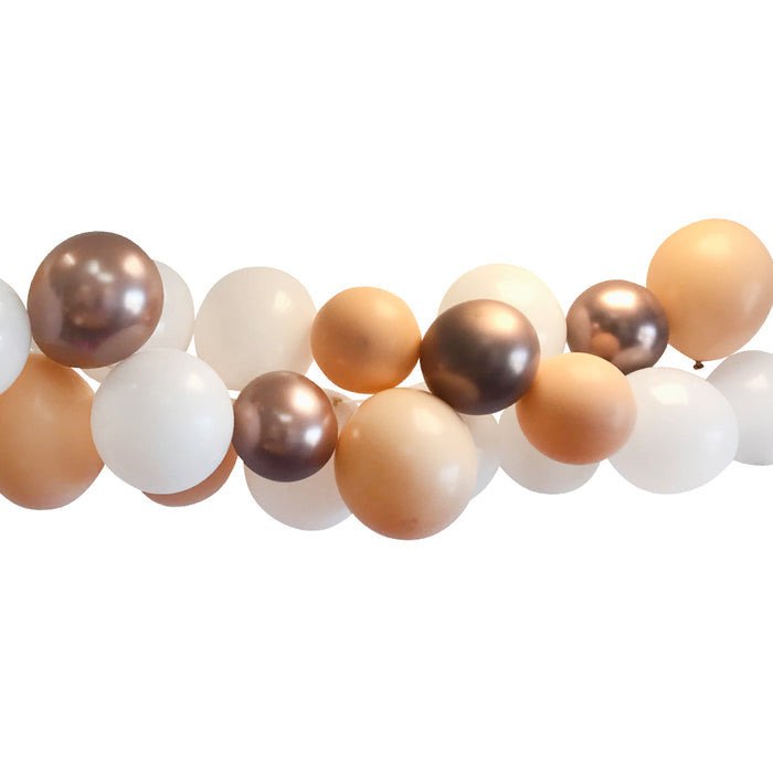 A garland of rose gold, white, and blush balloons arranged on a tape, displaying a gradient effect.