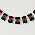 Celebrating Black History Bunting Draped on Wall with Light and Shade