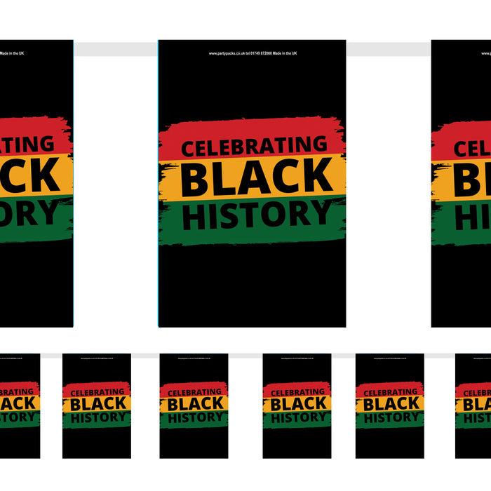 Paper flag bunting decoration with 'Celebrating Black History' text in red, yellow, and green colors