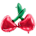 Metallic red and green balloon shaped like a cherry on a white background