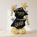 Congrats Grad Standing Balloon on Floor with Neutral Wall Background
