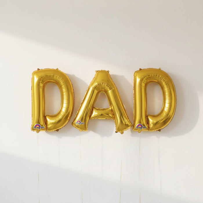 Gold DAD Foil Balloons on Wall