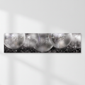 Silver disco-ball banner on a white wall