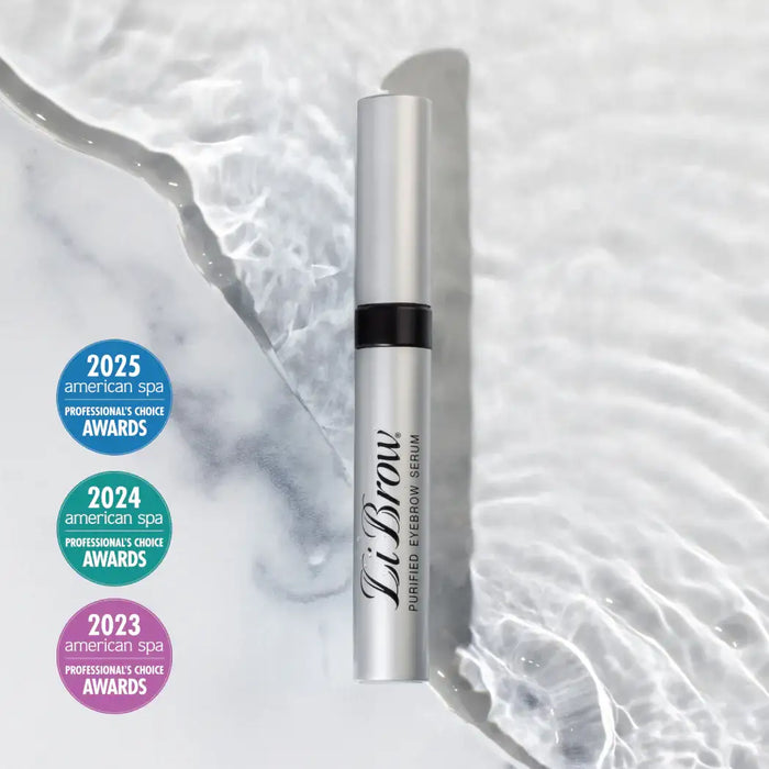 LiBrow purified eyebrow serum tube with 2023-2025 American Spa Awards badges on marble background