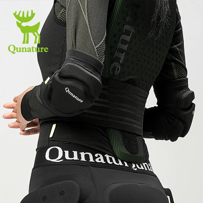 A woman wearing a pair of black elbow pads