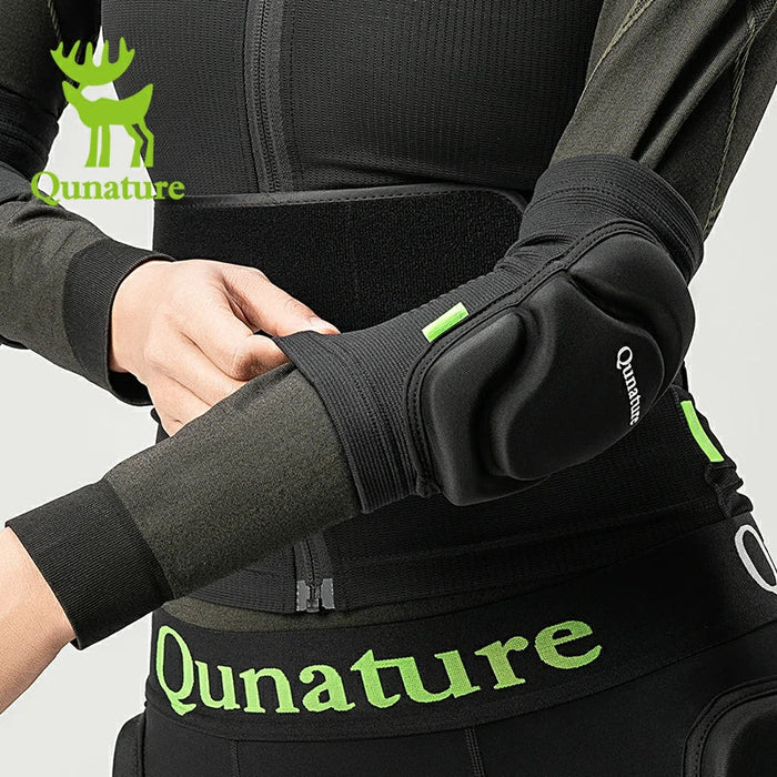 A person wearing a pair of black elbow pads