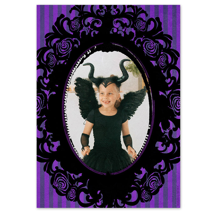 Child in a black costume with wings and horns, framed by a decorative purple and black border.
