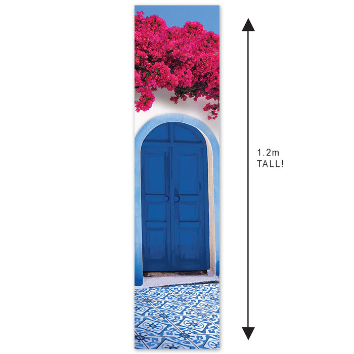 A portrait-oriented banner featuring a blue door with pink flowers above it, set against a white wall, representing a Mediterranean style.