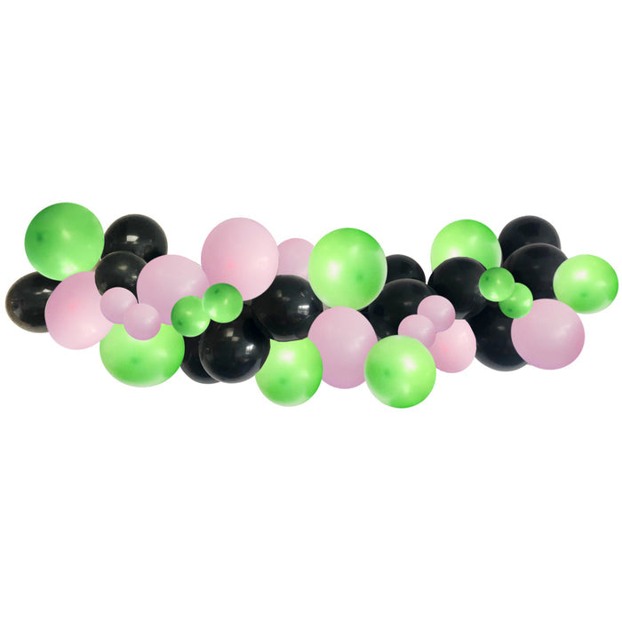 A DIY balloon arch kit with a mixture of green, black, and pink balloons arranged in a curved formation across a plain background.