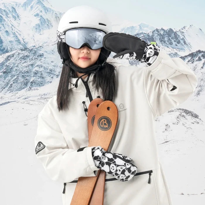 Person in skiing gear with a wooden ski and helmet against a snowy mountain background
