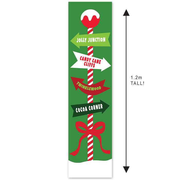 Decorative sign with candy cane design and Christmas-themed text on a green background.