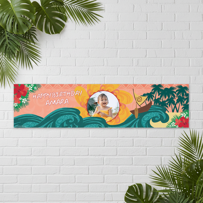 Moana Birthday Banner on White Brick Wall with Tropical Leaves
