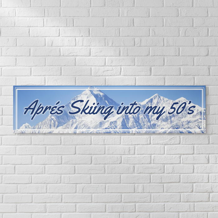 Après Skiing into my 50s Banner on White Brick Wall