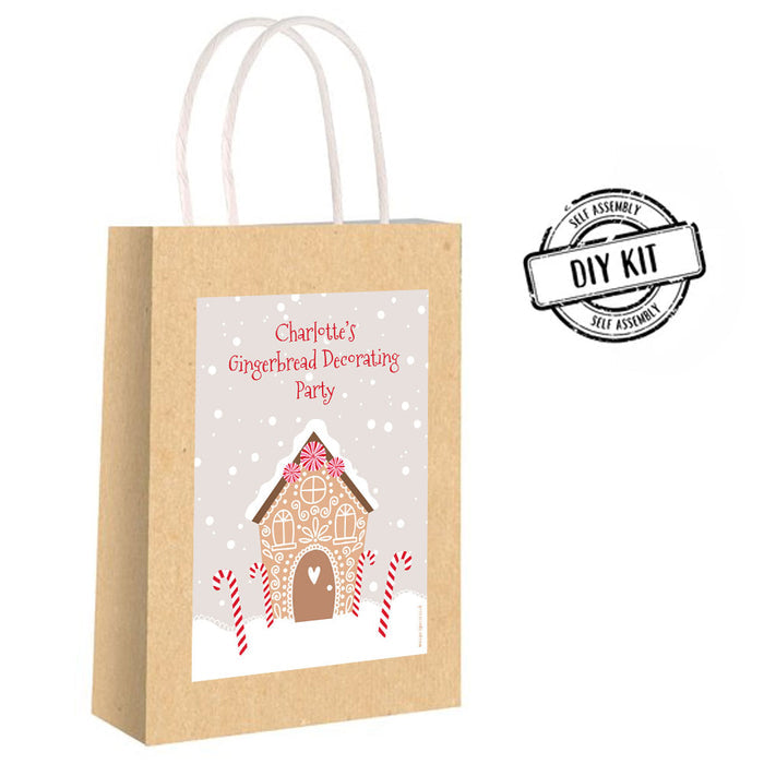 Kraft paper gift bag with a gingerbread house design and 'DIY Kit' label on a white background