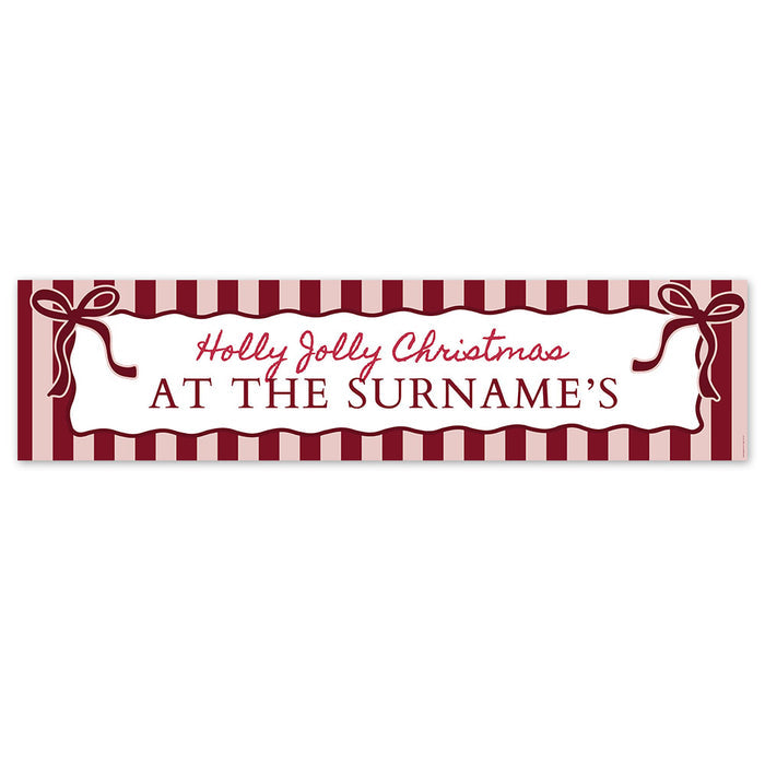 Personalized Christmas banner with red and white striped design and text 'Holly Jolly Christmas at The Surname's'.