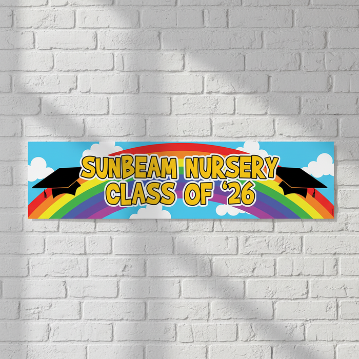 Rainbow Nursery Graduation Banner on White Brick Wall