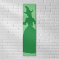 Witches of Oz Green Banner on White Brick Wall