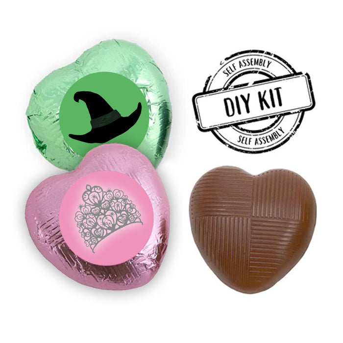 Pack of 24 heart-shaped milk chocolates with pink and green foils, some displaying stickers with witch hat and crown designs, labeled as a 'DIY Kit'.